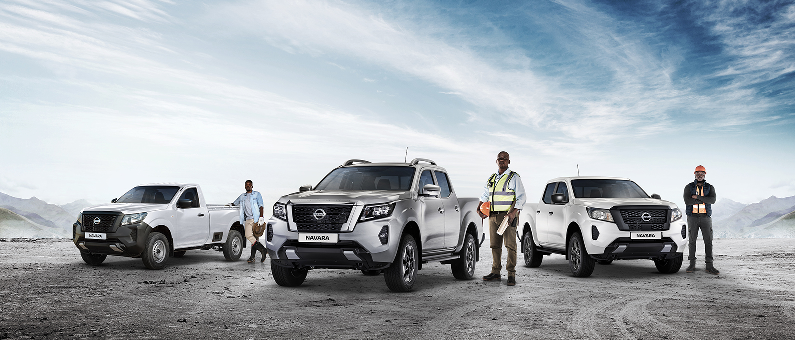 Nissan Navara Range with drivers next to them