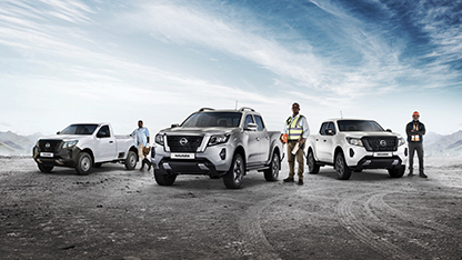 Nissan Navara Range with drivers next to them
